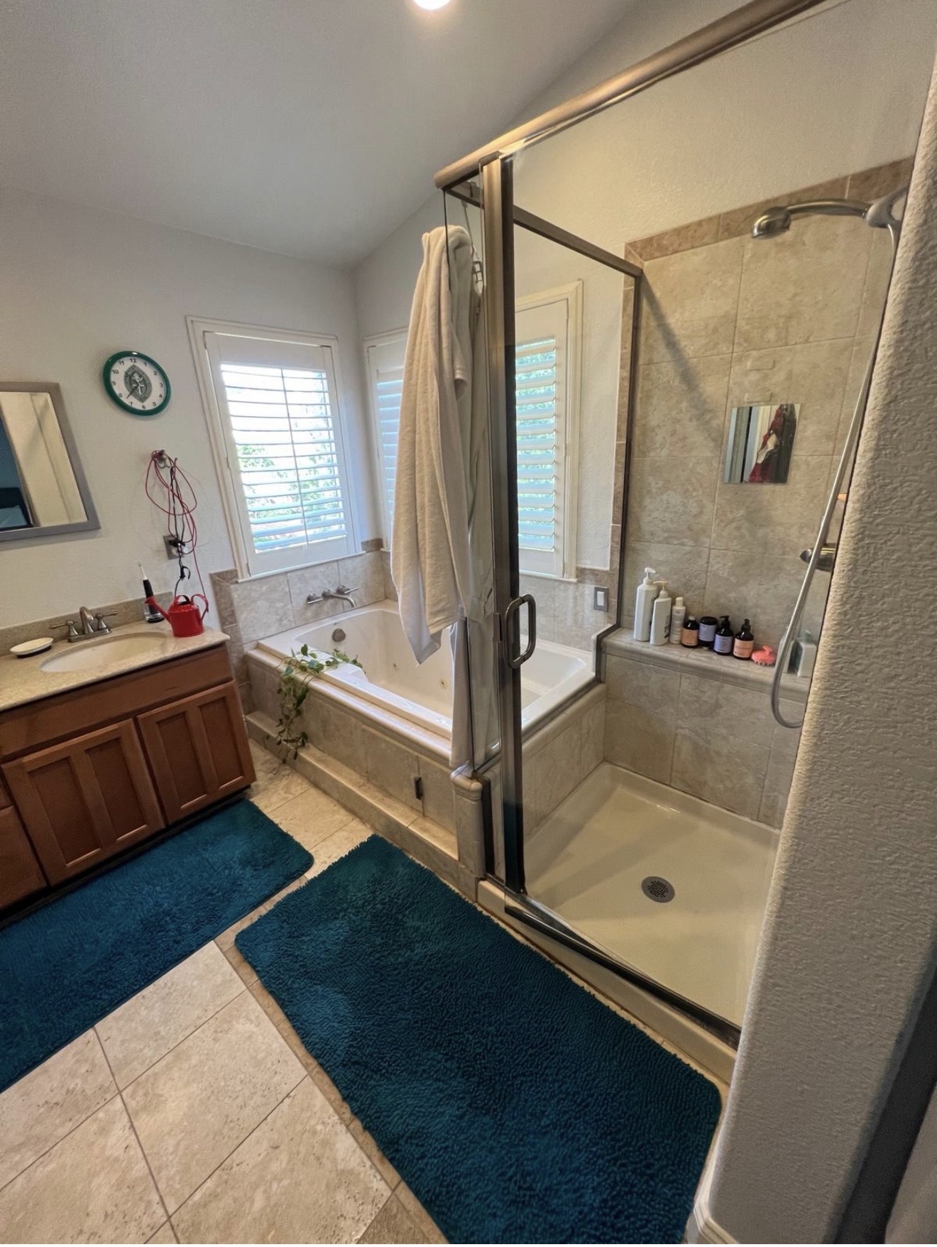Primary bath with tub and glass shower detailed by Go Live Cleaning