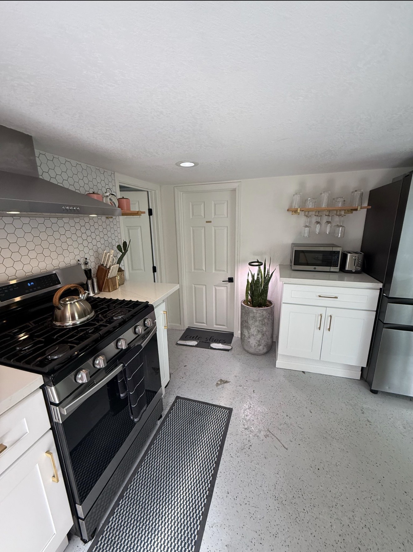 Modern kitchen with hex tile backsplash kept move-in fresh