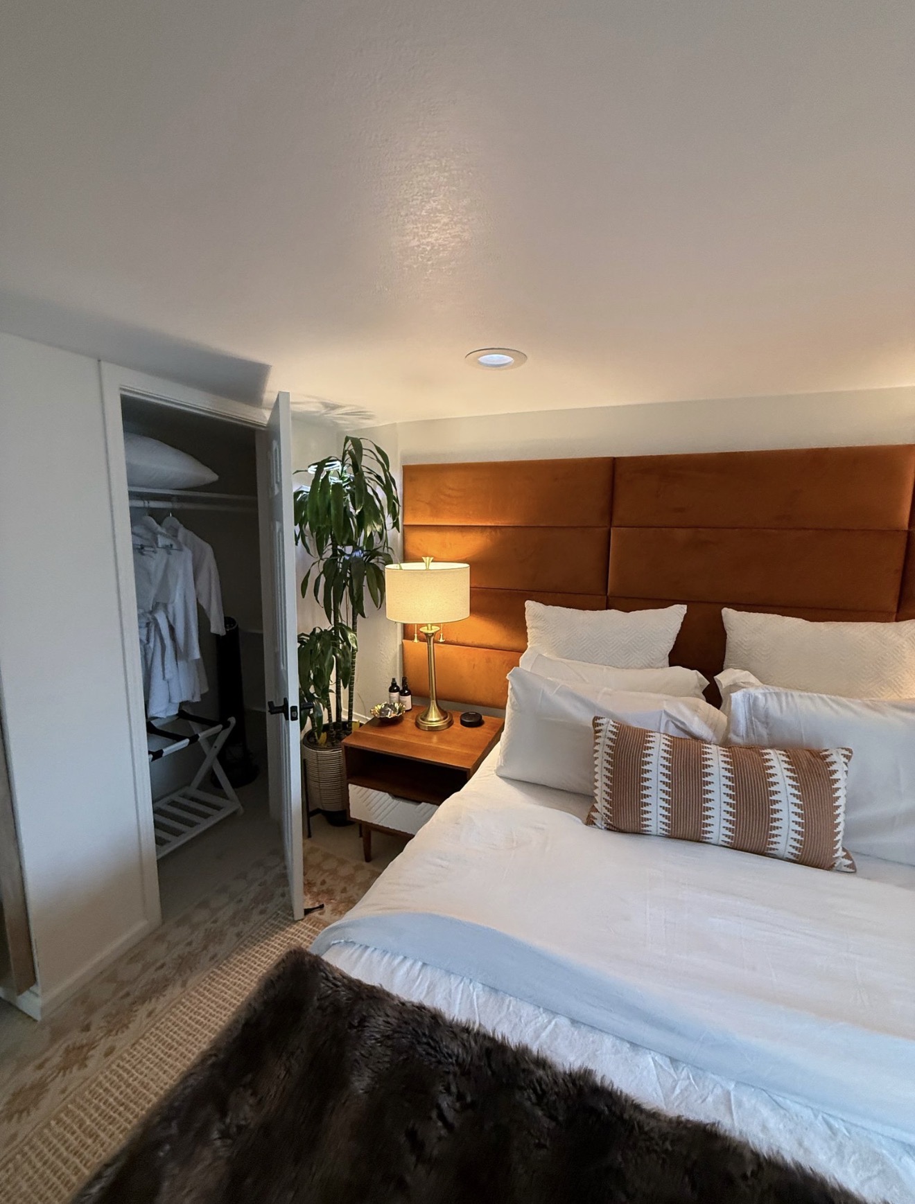 Cozy bedroom neatly made and dusted on a recurring visit