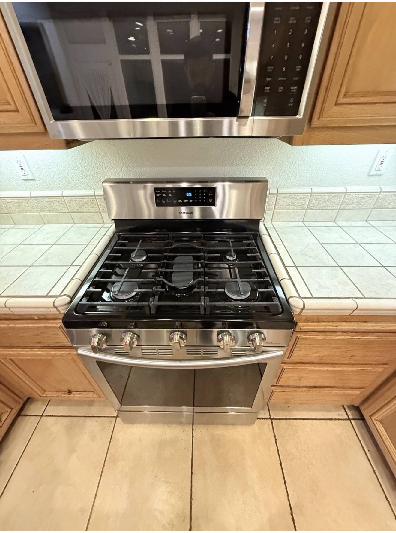Stainless gas range and microwave polished to a shine