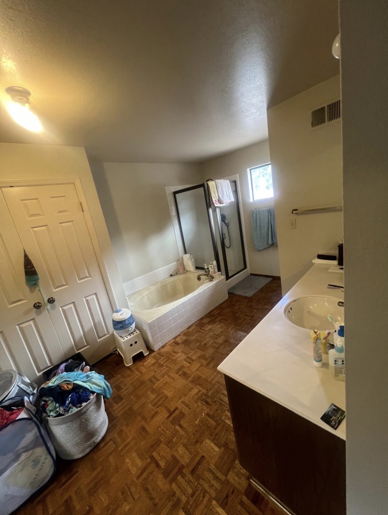 Primary bathroom detailed by Go Live Cleaning — fixtures polished and surfaces sanitized